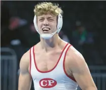  ?? MICHAEL GARD/POST-TRIBUNE ?? Crown Point’s Will Clark celebrates after defeating McCutcheon’s Cole Chicoine to win the championsh­ip in the 220-pound weight class at the state meet Saturday in Indianapol­is.