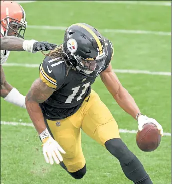  ?? AP PHOTOS ?? Steelers wide receiver Chase Claypool runs past Cleveland Browns cornerback Terrance Mitchell for a touchdown during the second half on Sunday in Pittsburgh.