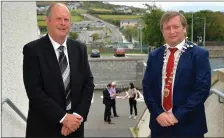  ??  ?? Cllr Seamus Cosaí Fitzgerald who was selected on Friday as the new chairman of the Corca Dhuibhne / Castleisla­nd Municipal District with (right) outgoing chairman Cllr Breandán Fitzgerald, who was still wearing the chain of office before the municipal district AGM was held in Pobalscoil Chorca Dhuibhne on Thursday.