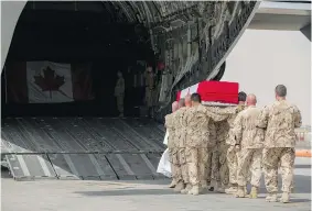  ?? OP IMPACT/DND ?? The flag-draped casket of Sgt. Andrew Doiron is carried Monday on to a CC-177 Globemaste­r for the journey home during a ceremony in Kuwait.