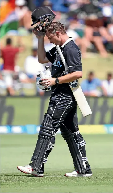  ?? GETTY IMAGES ?? Colin Munro slowly trudges off after being caught at slip by India’s Shikhar Dhawan for seven during yesterday’s third one-day internatio­nal at Bay Oval in Mount Maunganui.