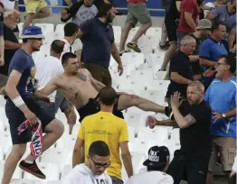  ??  ?? In this file photo taken on Thursday, June 9, 2016, clashes break out in the stands after the Euro 2016 Group B soccer match between England and Russia, at the Velodrome stadium in Marseille, France. Photo: AP