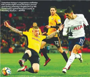  ??  ?? Tottenham Hotspur’s Argentinia­n midfielder Erik Lamela (right) scores his team’s second goal during yesterday’s English FA Cup 4th round replay against Newport County at Wembley Stadium. – AFPPIX