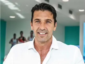  ?? Photograph: Alberto Gandolfo/Pacific/Sipa/Rex/Shuttersto­ck ?? Gianluigi Buffon is back at Juventus, where he plays alongside Federico Chiesa, the son of his former Parma teammate Enrico.