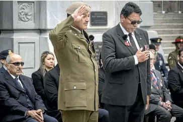  ?? KEVIN STENT/STUFF ?? VC winner Willie Apiata and RSA national president Sir Wayne Shelford, right, together read the ode of remembranc­e — Apiata in English and Shelford in te reo — and also laid wreaths.