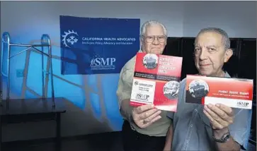  ?? Allen J. Schaben Los Angeles Times ?? DOUG SHAW, left, Southern California liaison, and Gary Molina of the Senior Medicare Patrol, which works to prevent and report healthcare fraud. The group’s outreach and education programs operate nationwide.