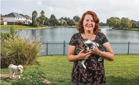  ?? Steve Gonzales / Staff photograph­er ?? Valerie Tolman, an avowed animal lover, holds foster kittens Bugsy and Blixin. She is a certified animal rescuer and sometimes nurses racoons, squirrels and opossums back to health so they can be released back to nature.