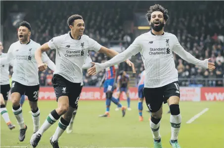  ??  ?? Mo Salah celebrates scoring against Crystal Palace.