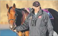  ??  ?? Rob Heathcote with Woorim. The trainer hopes to bring the seven-year-old back for the autumn.