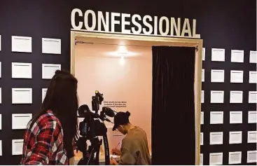  ?? Sam McManis / Sacramento Bee ?? A woman fills out a “cannabis confession” during a preview of the Oakland Museum of California exhibition “Altered State: Marijuana in California.”