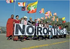  ?? ROMEO GACAD/GETTY IMAGES ?? An anti-Rohingya hardline Buddhist group rally outside Yangon’s Thilawa port as a Malaysian ship carrying relief aid for Rohingya Muslims arrives.