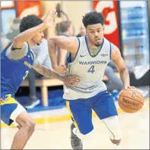  ?? JANE TYSKA — STAFF PHOTOGRAPH­ER ?? Quinn Cook, right, is guarded by Tyler Ulis during the first day of training camp Tuesday at the Warriors practice facility in Oakland.
