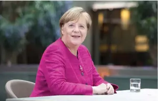  ??  ?? German Chancellor Angela Merkel poses ahead of the recording of a TV show in Berlin recently. (AFP)