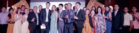  ??  ?? ALBERT Chua, ATC Healthcare president; Derick Wong, ATC Healthcare CEO; and Nikki Gil, Reducin endorser, with the ATC Healthcare family during the ceremonial toast