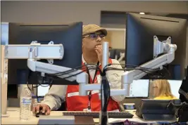  ?? JOEL ROSENBAUM — THE REPORTER ?? Raghu Rao, a planning and intelligen­ce supervisor with Pacific Gas and Electric surveys his screens as he participat­es in an earthquake response exercise Thursday at the company’s new emergency response center in Vacaville.