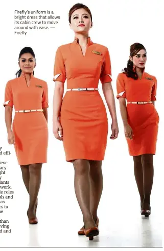  ?? — Firefly ?? Firefly’s uniform is a bright dress that allows its cabin crew to move around with ease.