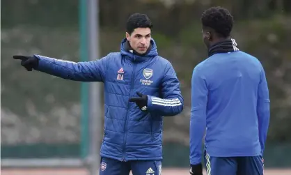  ?? Photograph: Stuart MacFarlane/Arsenal FC/Getty Images ?? Arsenal’s manager Mikel Arteta at a training session with Bukayo Saka, who is available for the Europa League second leg at Slavia Prague.