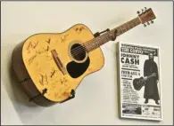  ?? ?? This guitar was played by Johnny Cash at a performanc­e in Jonesboro.