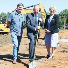  ??  ?? Member for McMillan Russell Broadbent is on site with a shovel in hand as the first earthworks are undertaken last Monday for a new early learning centre to be co-located on the Warragul Primary School. Also witnessing the beginning of works are Cr Michael leaney and mayor Mikaela Power.