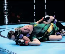  ?? JULIAN KIEWIETZ ?? NICOLE van Wyk places a strong rear-naked choke on Nadia Terblanche at the Africa MMA Championsh­ips in Johannesbu­rg. |