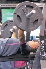  ?? GREGORY PAYAN/ASSOCIATED PRESS ?? Penn State running back Saquon Barkley bench presses during the NFL scouting combine Thursday in Indianapol­is. Barkley is expected to be a top-five pick in next month’s NFL Draft.