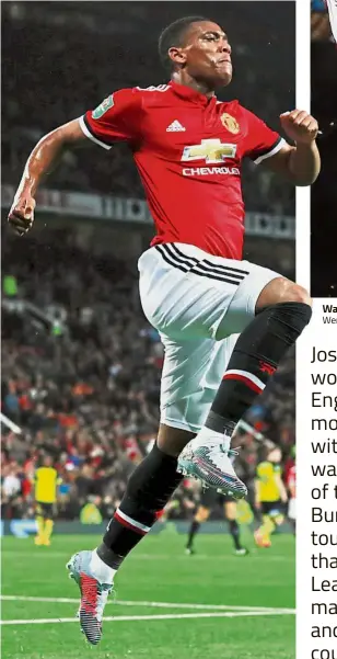  ?? — Reuters ?? No sweat: Anthony Martial leaping for joy after scoring Manchester United’s fourth goal against Burton in the English League Cup third round on Wednesday. United won 4-1 to set up a fourth-round clash with Swansea.