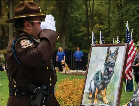  ?? PHOTO COURTESY OF M. JANE PURSLOW ?? The Michigan War Dog Memorial honors military and service dogs who have lost their lives.