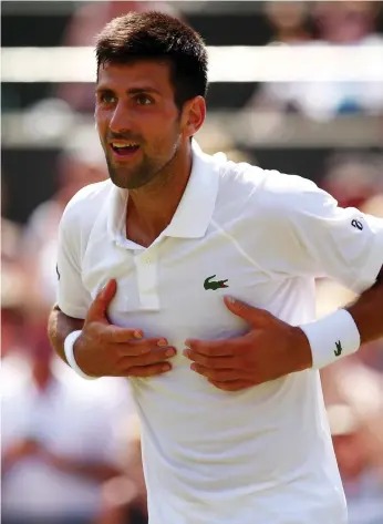  ?? Clive Brunskill /Getty Images ?? Novak Djokovic played his first full match at Wimbledon, defeating Adam Pavlasek 6-2. 6-2, 6-1. ‘Exactly what I want,’ he said. ‘I don’t want to have any five-set matches’