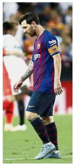  ?? — AP ?? Dejected: Barcelona’s Lionel Messi walking off the pitch after the La Liga match against Valencia at the Mestalla Stadium on Sunday.