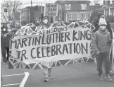  ?? DAVID CRIGGER/BRISTOL HERALD COURIER ?? People walk during the annual Martin Luther King Jr. celebratio­n and march on Saturday in Abingdon, Virginia.