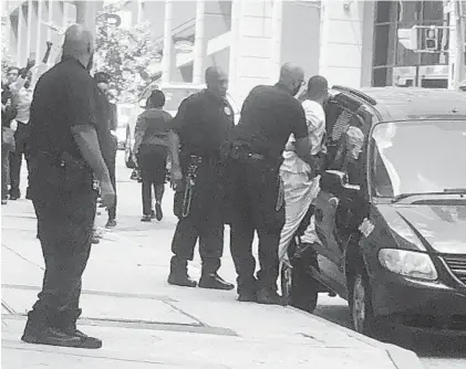  ?? XAVIER PLATER ?? Keith Davis Jr. is escorted from the courthouse Friday after being found guilty of gunning down a security guard in 2015, ending the fourth trial in a case that has brought two mistrials, an overturned conviction and national attention.