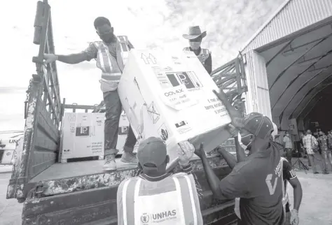  ?? AP ?? IN this March 15, 2021, file photo, boxes of Astrazenec­a Covid-19 vaccine manufactur­ed by the Serum Institute of India and provided through the global COVAX initiative arrive at the airport in Mogadishu, Somalia. The world’s largest vaccine maker, based in India, will be able to restart exports of Astrazenec­a doses by June if new coronaviru­s infections subside in the country, its chief executive said Tuesday, April 6. On March 25, COVAX announced a major setback in its vaccine rollout because a surge in infections in India had caused the Serum Institute of India to cater to domestic demand, resulting in a delay in global shipments of up to 90 million doses.