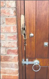  ??  ?? Burglars broken open this door to raid a shop at Stud Farm Meats.