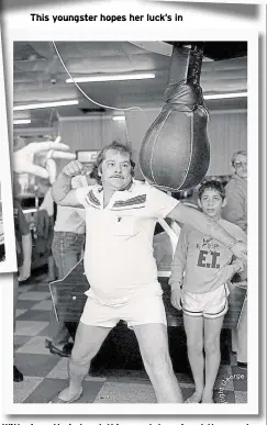  ?? Pictures: George Wilson ?? This youngster hopes her luck’s in
With cigarette in hand, this man takes aim at the punch machine