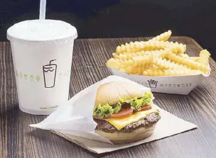  ??  ?? Shack up with the classics: ShackBurge­r, crinkle-cut fries, and shake