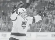  ?? Associated Press ?? Los Angeles Kings right wing Dustin Brown celebrates after scoring the game-winning shoot-out goal against the Colorado Avalanche during a preseason game on Sept. 27.