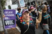  ?? PHOTOS CONTRIBUTE­D BY BRANDEN CAMP ?? Demonstrat­ors march in Atlanta on Saturday during a protest before the confirmati­on of Supreme Court nominee Brett Kavanaugh.