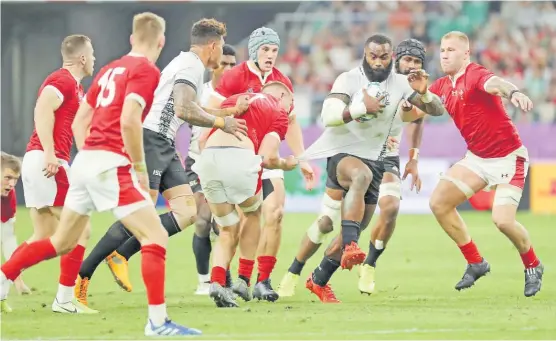  ?? Picture: JOVESA NAISUA ?? Flying Fijians centre Semi Radradra attacks against Wales during their pool match at the Oita Stadium in Oita, Japan.