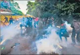  ?? AFP ?? Police fire tear gas to disperse university students protesting against President Gotabaya Rajapaksa in Colombo.