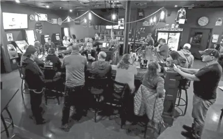  ?? WILLIAM GLASHEEN, USA TODAY NETWORK-WISCONSIN ?? The Dairyland Brew Pub in Appleton opened to patrons in May following the Wisconsin Supreme Court’s decision to strike down Gov. Tony Evers’ safer-at-home order.