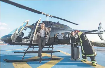  ??  ?? Brazilian businessma­n Boyle disembarks from the helicopter upon arriving in Guarulhos, some 20 km from Sao Paulo on June 23. Airbus’ subsidiary Voom gives an alternativ­e for those willing to avoid Sao Paulo’s heavy car traffic, offering a helicopter...