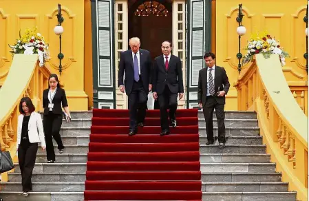  ?? — Reuters ?? Road to friendship: Trump and Tran leaving the Presidenti­al Palace in Hanoi before holding a press conference with the internatio­nal media.