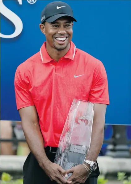  ?? GERALD HERBERT/ THE ASSOCIATED PRESS ?? Tiger Woods won The Players Championsh­ip golf tournament at TPC Sawgrass on Sunday in Ponte Vedra Beach, Fla.