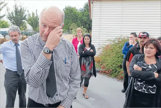  ?? Photo: KIRK HARGREAVES/FAIRFAX NZ ?? Crying shame: Phillipsto­wn School principal Tony Simpson tells staff the bad news that they will merge with Woolston.