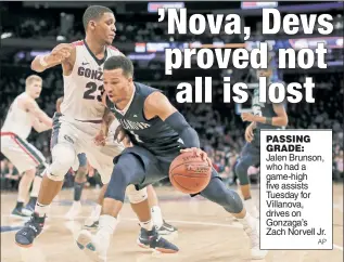  ?? AP ?? PASSING GRADE: Jalen Brunson, who had a game-high five assists Tuesday for Villanova, drives on Gonzaga’s Zach Norvell Jr.