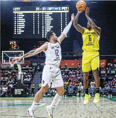  ?? ?? Dylan Whitbread of Cape Town Tigers in action against Petro de Luanda’s Carlos Morais during the Basketball Africa League clash at Sun Arena in Pretoria yesterday. Picture: Barry Aldworth