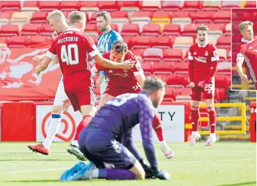  ??  ?? Dons match-winner Ross McCrorie celebrates his goal past Killie keeper Danny Rogers