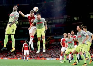  ?? AFP ?? Arsenal’s German defender Per Mertesacke­r (second from left) vies with Cologne’s Jhon Andres Cordoba Copete (left) and Marco Hoger during their Europa League match at the Emirates Stadium in London on Thursday. —