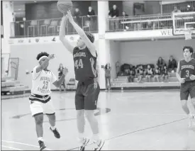  ?? Photo by Becky Polaski ?? ECC senior Charlie Breindel, 44, puts up a three-point shot for the Crusaders during their PIAA 1A second round game against Farrell. Breindel led all scorers in the game with 28 points.