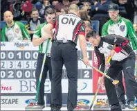 ?? CP PHOTO ?? Ontario skip John Epping sweeps a rock in front of Saskatchew­an skip Steve Laycock, right, as Patrick Janssen and Matt Dunstone, left, look on at the Tim Hortons Brier curling championsh­ip at the Brandt Centre in Regina on Wednesday.